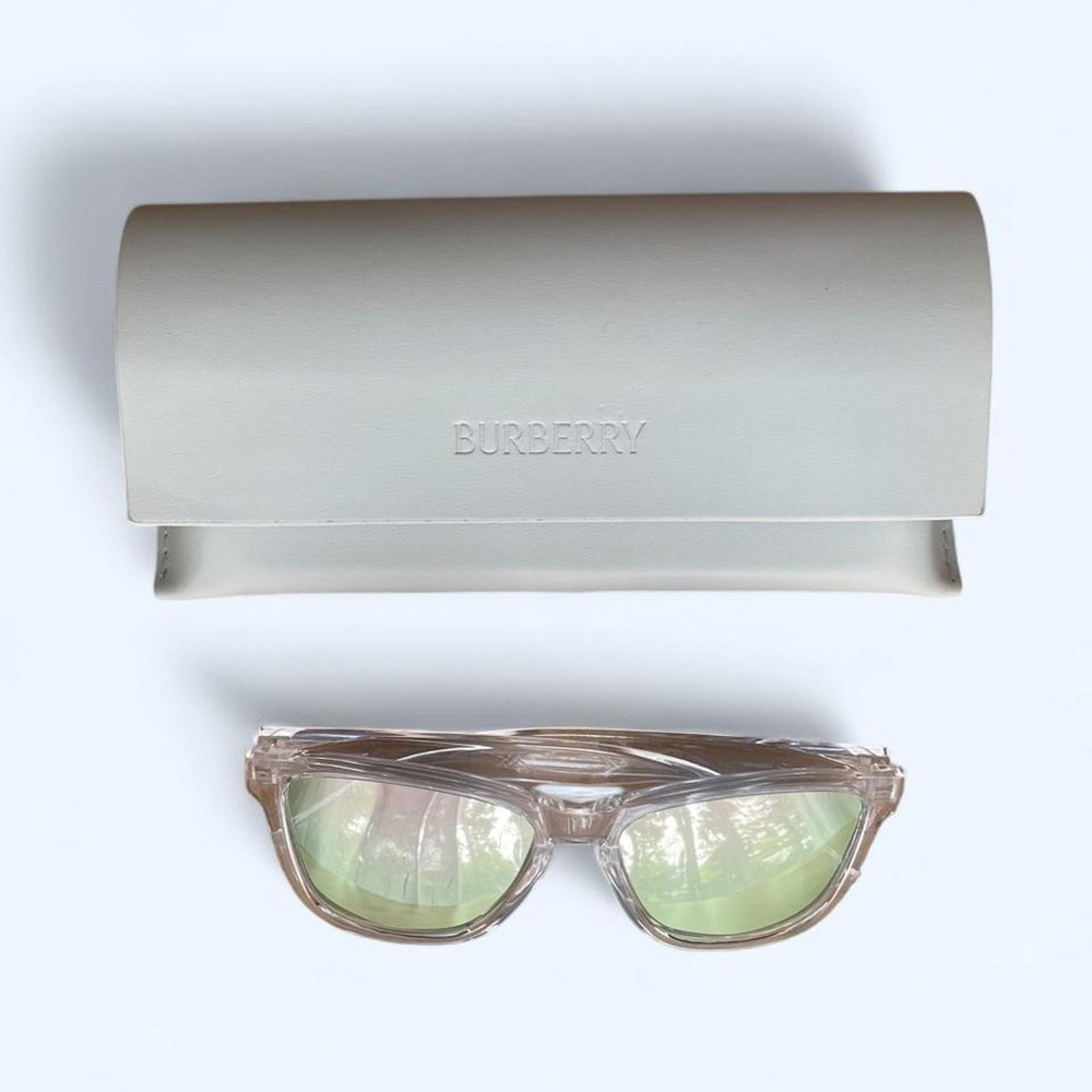Clear sunglasses with pink mirror lenses and white case